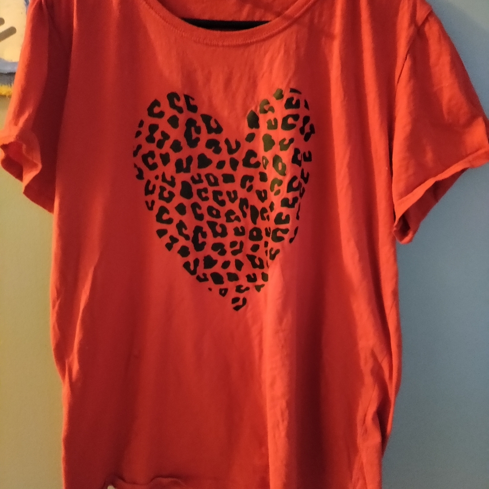 Red T-shirt with cheetah heart.